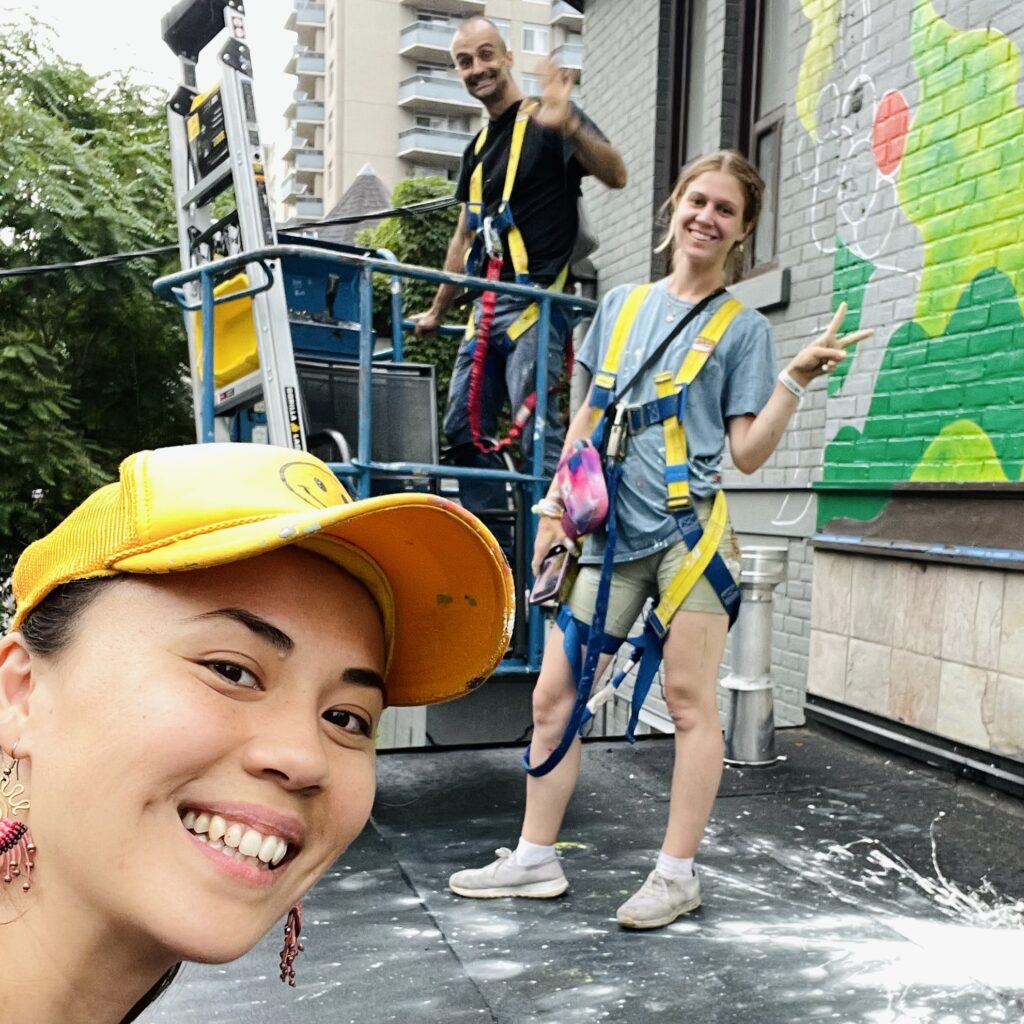 (L-R) Kseniya Tsoy, Rob Matejka and Frannie Potts working on The Story In Your Cup of Coffee Community Mural